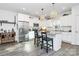 Modern kitchen with white cabinets, granite countertops, and island at 5510 Brickstone Dr, Charlotte, NC 28227