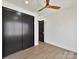 Modern bedroom with dark closet doors and light wood floors at 5700 Mcwhorter Rd, Waxhaw, NC 28173