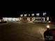 Modern home exterior at night with long driveway at 5700 Mcwhorter Rd, Waxhaw, NC 28173