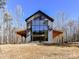 Modern farmhouse exterior, featuring a large window at 5700 Mcwhorter Rd, Waxhaw, NC 28173