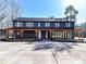 Farmhouse exterior with a covered patio and long driveway at 5700 Mcwhorter Rd, Waxhaw, NC 28173