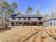 Home exterior showcasing a long covered patio at 5700 Mcwhorter Rd, Waxhaw, NC 28173