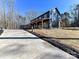 Modern farmhouse with large windows and covered porch at 5700 Mcwhorter Rd, Waxhaw, NC 28173