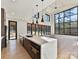 Modern kitchen with large island, stainless steel appliances, and hardwood floors at 5700 Mcwhorter Rd, Waxhaw, NC 28173