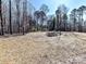 Cleared lot ready for new construction, surrounded by mature trees at 5700 Mcwhorter Rd, Waxhaw, NC 28173