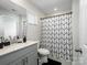 Contemporary bathroom with a black and white shower curtain and gray vanity at 571 Palmarosa St # 130, Fort Mill, SC 29715