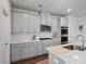 Well-lit kitchen with stainless steel appliances, and gray cabinets at 571 Palmarosa St # 130, Fort Mill, SC 29715