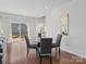 Bright living room with hardwood floors, a glass table, and a sliding glass door leading outside at 571 Palmarosa St # 130, Fort Mill, SC 29715