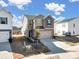 View of the house showing backyard, neutral siding, and an attached two car garage at 571 Palmarosa St # 130, Fort Mill, SC 29715