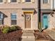 Townhome front entrance with brown door, wreath, and landscaping at 674 Dunkins Ferry Rd, Rock Hill, SC 29730