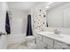 Bathroom with tub, shower, and colorful accent wall at 693 Candela Ct, York, SC 29745