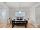 Charming dining area with a dark wood table and bench seating at 693 Candela Ct, York, SC 29745