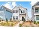 Two-story house with white siding, black shutters, and a landscaped yard at 693 Candela Ct, York, SC 29745