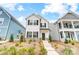 Two-story white house with black shutters, stone accents, and landscaping at 693 Candela Ct, York, SC 29745