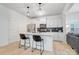 Modern kitchen with white cabinets, quartz countertops, and island at 693 Candela Ct, York, SC 29745