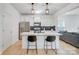 Modern kitchen with white cabinets, quartz countertops, and island at 693 Candela Ct, York, SC 29745