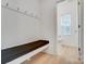 Mudroom features built-in bench and hooks for coats and bags at 693 Candela Ct, York, SC 29745