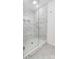 Walk-in shower with marble tile and built-in seat at 693 Candela Ct, York, SC 29745