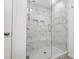 Large walk-in shower with marble tile and built-in seat at 693 Candela Ct, York, SC 29745