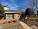 Brick ranch home with landscaping and walkway at 715 21St Ne Ave, Hickory, NC 28601