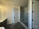 Bathroom featuring glass enclosed walk-in shower, large vanity with sink, and tiled floors at 8704 Sherrills Ford Rd, Sherrills Ford, NC 28673