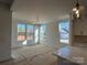 Dining area with lots of natural light and a modern chandelier at 8704 Sherrills Ford Rd, Sherrills Ford, NC 28673