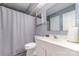 Clean bathroom with white vanity and shower/tub combo at 9427 S Vicksburg Park Ct, Charlotte, NC 28210