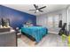 Bright bedroom with teal bedding, ceiling fan, and window seat at 9427 S Vicksburg Park Ct, Charlotte, NC 28210