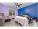 Bedroom with multicolored bedding and ceiling fan at 9427 S Vicksburg Park Ct, Charlotte, NC 28210