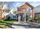 Brick front exterior of charming townhome with landscaping at 9427 S Vicksburg Park Ct, Charlotte, NC 28210