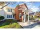 Brick front exterior of charming townhome with landscaping at 9427 S Vicksburg Park Ct, Charlotte, NC 28210