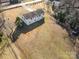 Aerial view showing a ranch house with large backyard and surrounding trees at 1241 Red River Rd, Rock Hill, SC 29730