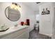 Elegant bathroom with a large vanity and a round mirror at 1241 Red River Rd, Rock Hill, SC 29730