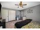 Bedroom with king-size bed, gray walls, and double doors leading to the bathroom at 1241 Red River Rd, Rock Hill, SC 29730