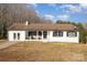 White ranch house with attached garage and a spacious yard at 1241 Red River Rd, Rock Hill, SC 29730