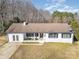 White ranch house with dark roof, front porch, and attached garage at 1241 Red River Rd, Rock Hill, SC 29730