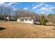 White ranch house with yard and trees in background at 1241 Red River Rd, Rock Hill, SC 29730