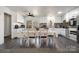 Kitchen with white cabinets, granite counters, and dining table at 1241 Red River Rd, Rock Hill, SC 29730