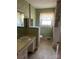 Bathroom with vintage vanity, tiled walls, and bathtub at 147 W Mcneely Ave, Mooresville, NC 28115