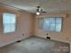 Bedroom with light walls, carpet, and ceiling fan at 147 W Mcneely Ave, Mooresville, NC 28115