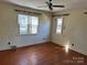 Bright bedroom with hardwood floors and ceiling fan at 147 W Mcneely Ave, Mooresville, NC 28115