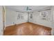 Bright bedroom with hardwood floors and multiple windows at 147 W Mcneely Ave, Mooresville, NC 28115