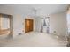 Bright bedroom with wood closet doors and carpet at 147 W Mcneely Ave, Mooresville, NC 28115