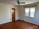 Hardwood floor bedroom with ceiling fan and large closet at 147 W Mcneely Ave, Mooresville, NC 28115