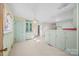 Bright dining area with pale green cabinets and floral wallpaper at 147 W Mcneely Ave, Mooresville, NC 28115