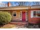 Front porch detail, red door, brick and stone exterior at 147 W Mcneely Ave, Mooresville, NC 28115