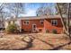 Rear view of brick house with landscaping at 147 W Mcneely Ave, Mooresville, NC 28115