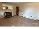 Living room with fireplace and built in shelving at 147 W Mcneely Ave, Mooresville, NC 28115