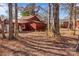 Red outbuilding among trees in backyard at 147 W Mcneely Ave, Mooresville, NC 28115