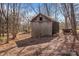 Old wooden shed in wooded area at 147 W Mcneely Ave, Mooresville, NC 28115